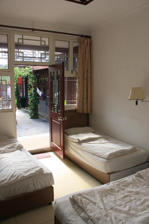 Three Legged Frog Hostel Beijing Rom bilde